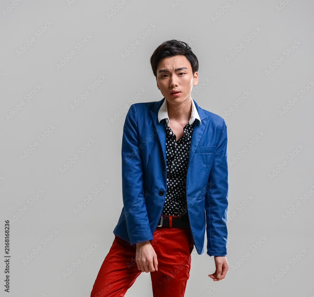 Fototapeta premium Stylish East Asian Man in Polka Dot Blazer Studio Portrait