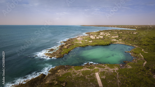Aerial view of luxury resort and stunning cliff overlooking the turquoise Caribbean Sea.Summer vacation and travel destination. Playa del Carmen, Riviera Maya, Mexico.