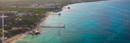 Lighthouse on the beach of the turquoise Caribbean sea at sunset, Summer Vacation Concept, Bayahibe, Dominican Republic.