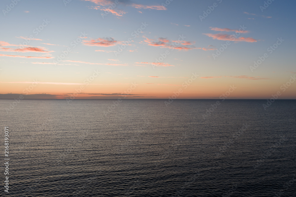 Fototapeta premium Aerial view of calm sea at dusk after sunset over Gulf of Finland Baltic sea