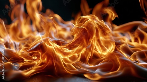 Blazing fire with swirling orange and red flames creating a warm energetic background element and dangerous
