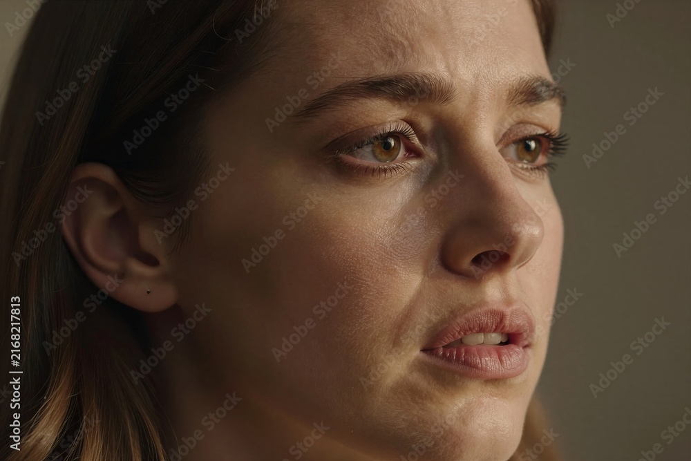 Fototapeta premium Close Of Individuals Face On Left Side Against Neutral Background Person To Fair Skin With Freckles Suggesting Belong Light Skinned
