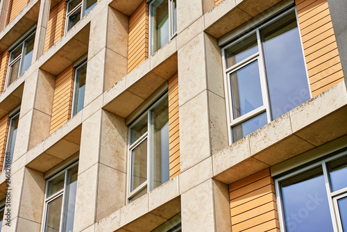 Cuadro en lienzo Building facade with concrete frames and rows of windows