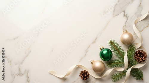 Christmas ornaments with pine branches on marble background