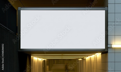 Illuminated modern tunnel with blank illuminated billboard above