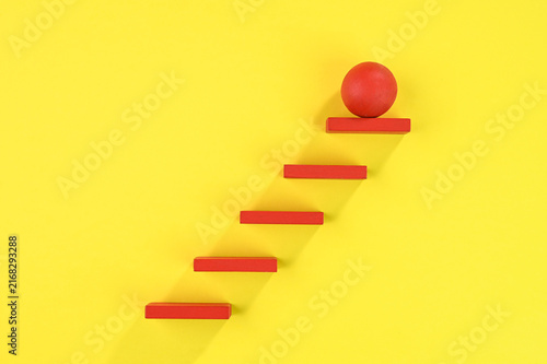 Steps to success. Red steps on yellow background.
