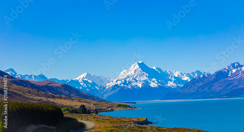 фотографія The landscape view with coast of road highway with mount cook mountain and Blue