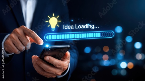 Businessman using a smartphone to generate new creative ideas and innovation concepts.
