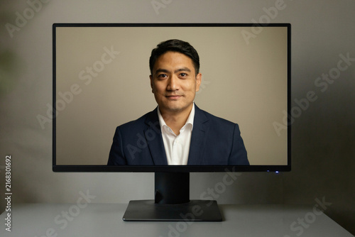 Professional man on a computer monitor screen