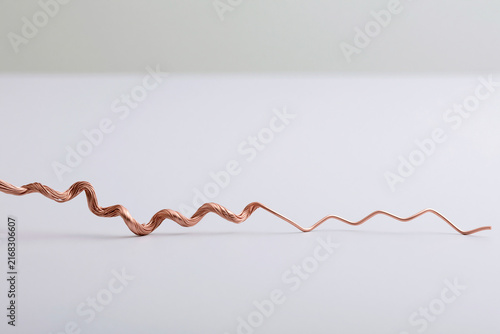 Twisted copper wire representing an electric spark sensory concept