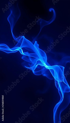 Flowing blue smoke waves on dark abstract background
