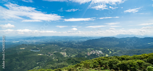 Obraz na plátne Panoramic aerial view of Beppu city and Beppu bay under blue sky with clouds fro