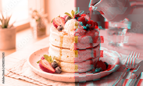 Fluffy pancake stack with fresh berries and maple syrup with split tone glitch effect
