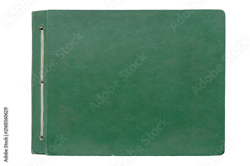 Old green photo album with string binding holding memories. Isolated
