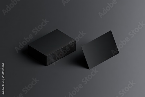 Minimalist black cards on dark background, one stacked, one angled