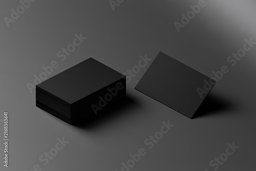 Two stacks of blank black rectangles on a muted gray surface