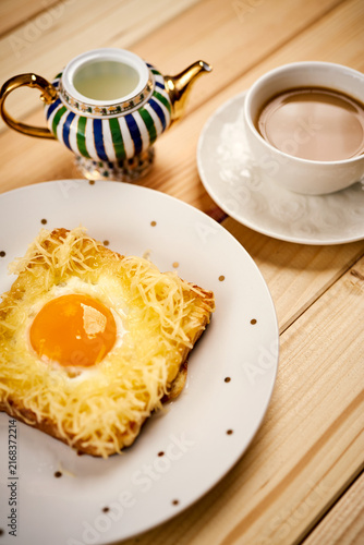 Cuadro en lienzo breakfast set with coffee and toast with egg on wooden table