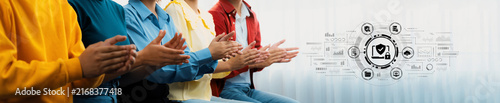 Konstfotografi Group of diverse people applauding during a presentation with digital icons on a blurred background representing technology and engagement in a modern setting
