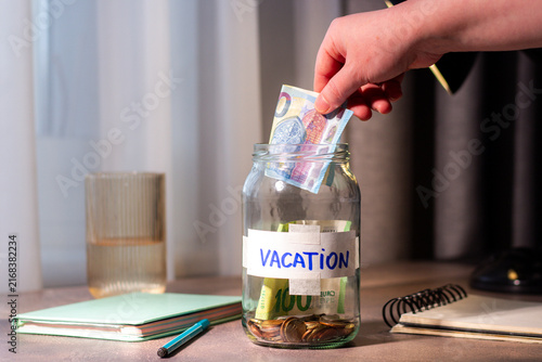 Fotografie Vacation savings in jar