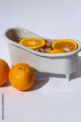 Aperol Spritz in a Miniature Bathtub with Orange Slices and Ice