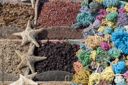 Dried starfish and colorful oriental spices in sacks at Old Market Sharm, El Sheikh, Egypt