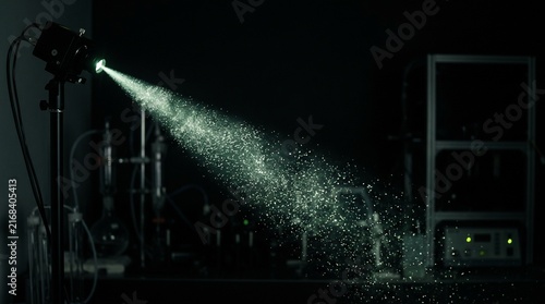 Industrial Water Spray in Dark Factory Setting.