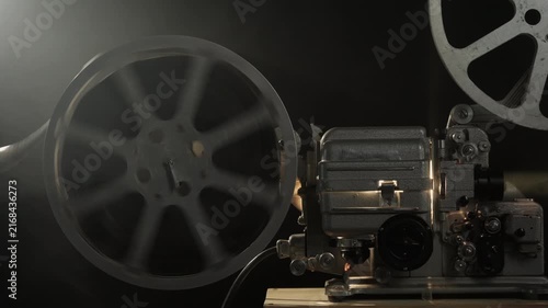 Film on rotating reel on vintage movie projector ended or broke during screening