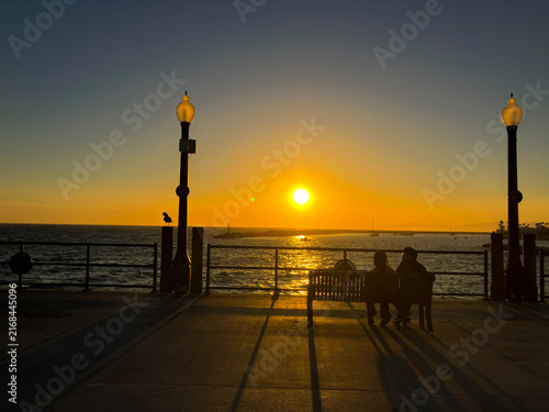 Silhouettes of Two People Watching Sunset at Redondo Beach Pier, California