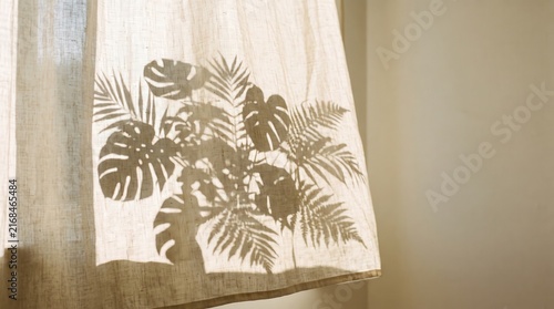 Intricate Shadow of Tropical Leaves on Sheer Fabric Curtain