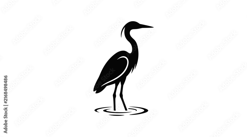 Naklejka premium Silhouette of a Great Blue Heron standing in shallow water.