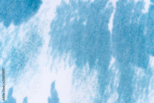 Textured blue watercolor background with central copy space.