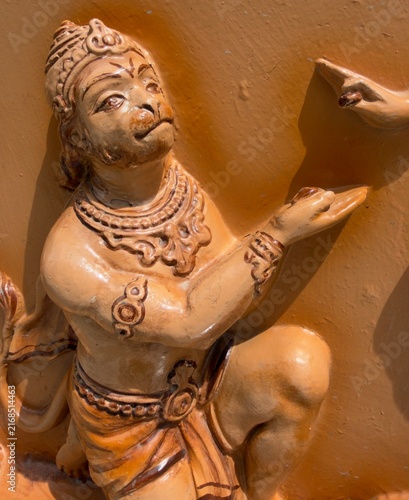 Картината върху платно Detailed carved relief sculpture of Lord Hanuman in devotional pose from Indian