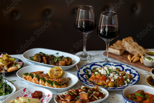 Delightful Dinner Spread Showcasing Vibrant Dishes and Fine Wine