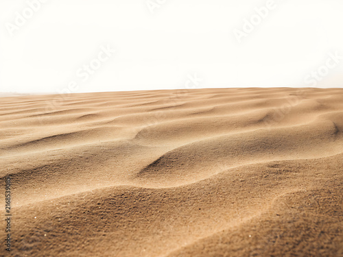 Sand Dune Texture and Rolling Desert Sand Dunes Under Clear Sky in Arid Landscape Nature Background