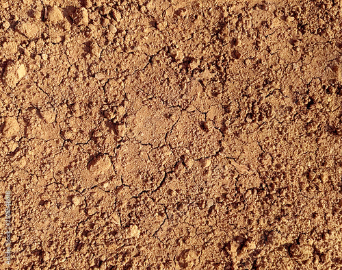 Texture of the ground. Cracked sand background texture. Only commercial use. 
