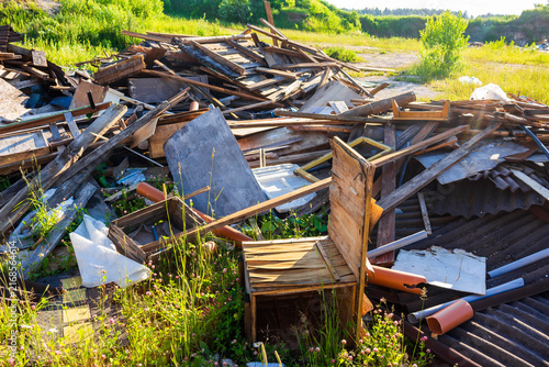 Quadro su tela Messy pile of old broken wooden planks, rotting timber, scraps, and discarded ju