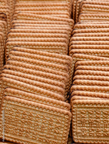Fresh sweet cookies displayed in a supermarket, featuring baked products presented attractively for customers and shoppers as part of the available food selection