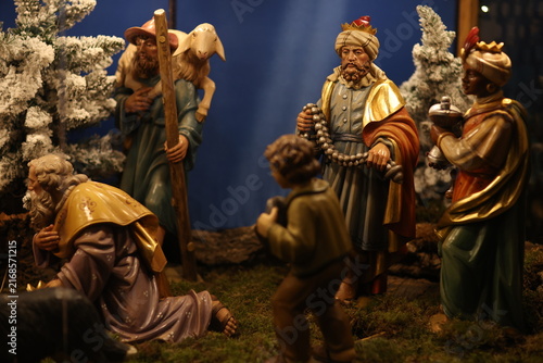 Fotografie Traditional nativity scene figurines depicting biblical characters in a Christmas manger display