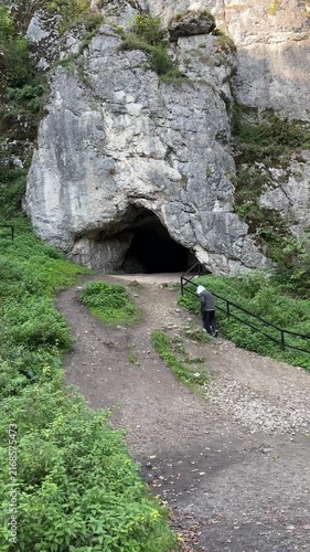 Limestone cave entrance in forest