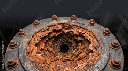 Corrosion narrowing cast iron pipe flange opening closeup
