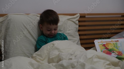 Mother reading bedtime story to son