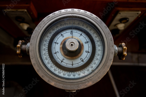 Fotografía Top view of vintage nautical gyrocompass navigation repeater with round degree scale dial and metal adjustment knobs in ship bridge wheelhouse