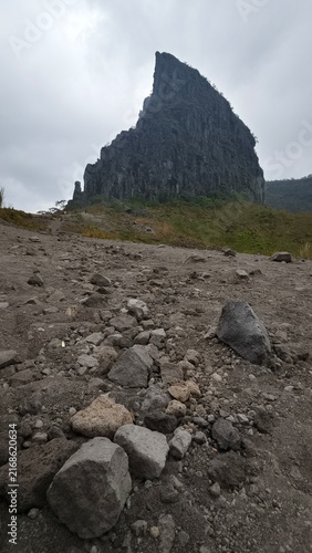 Jagged Volcanic Rock Formation under Cloudy Sky