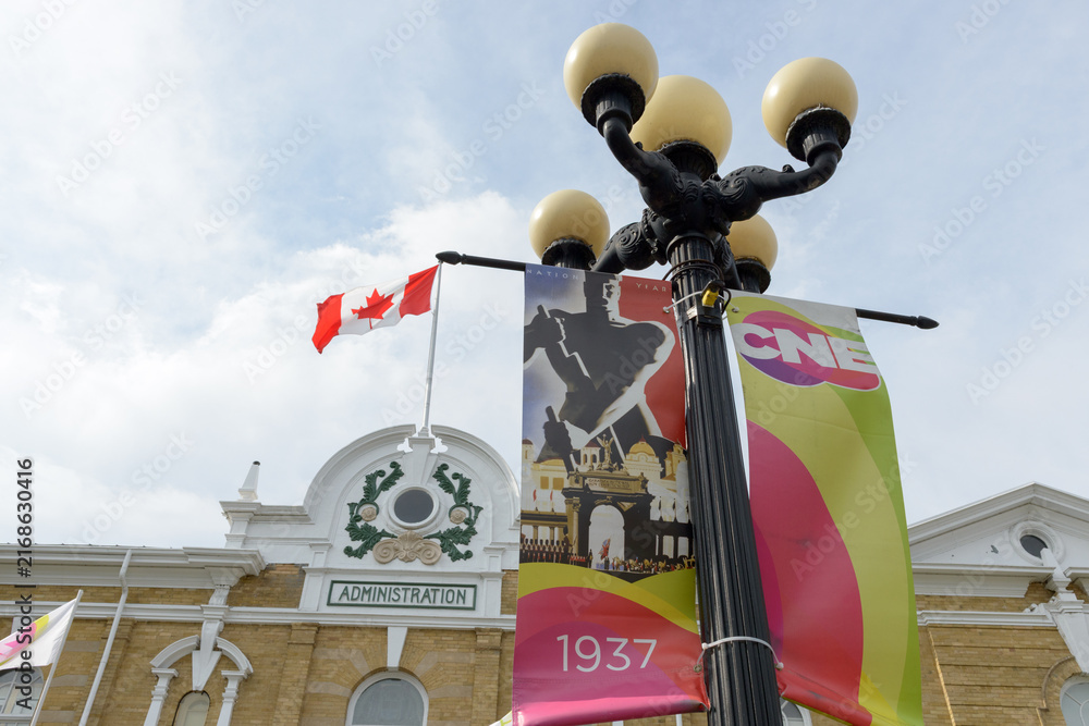 Obraz premium lamp post mounted CNE banners outside the CNE Administration Building, Exhibition Place, Toronto (22 August 2026)
