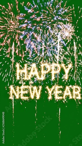 Happy New Year Text Made of Burning Sparklers with Colorful Fireworks Exploding on a Green Screen Background