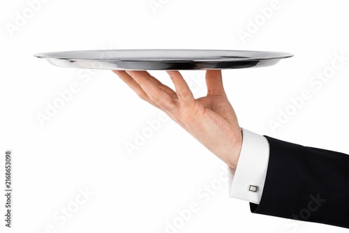 Professional waiter hand balancing an empty silver platter against white background