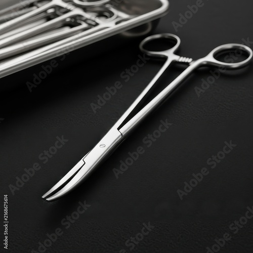 Gleaming Stainless Steel Surgical Scissors and Medical Instruments in a Tray
