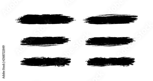 Black grunge brush strokes creating various textured paint lines for artistic design elements dirty background effect to frame text.