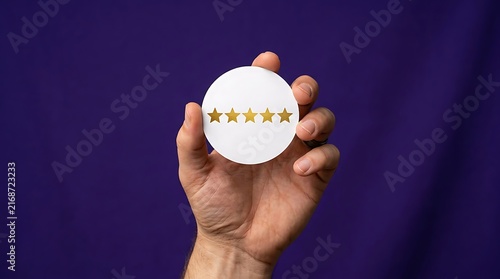 Five star rating symbol held in hand against purple background, gold stars on white circle for customer feedback, premium quality service review icon for business reputation management