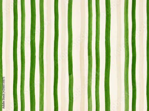 Vertical stripes pattern background featuring hand drawn green and beige lines in a simple minimalist style for creative textile designs